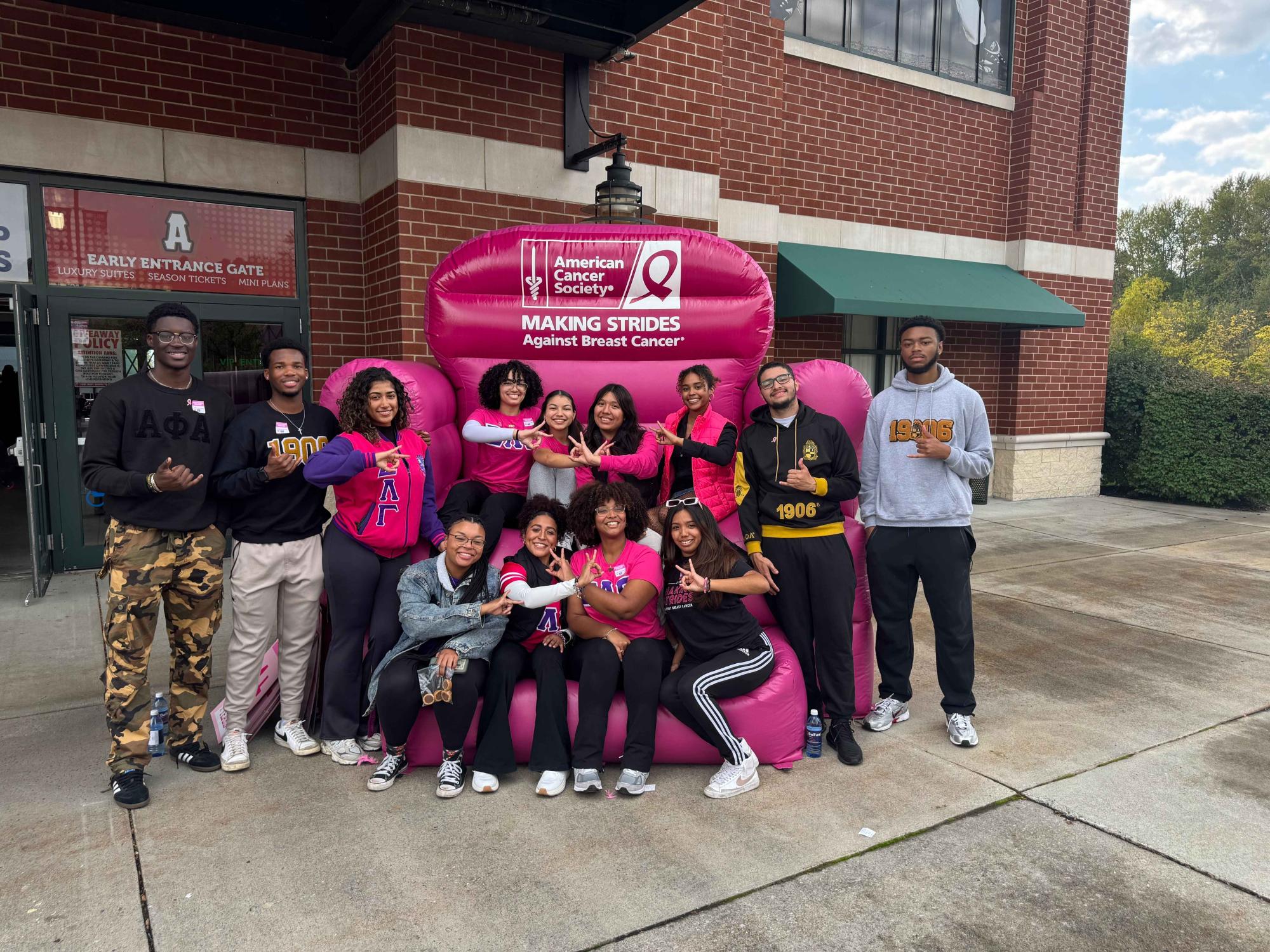 Members of Sigma Lambda Gamma and Alpha Phi Alpha at Breast Cancer Walk event in Altoona