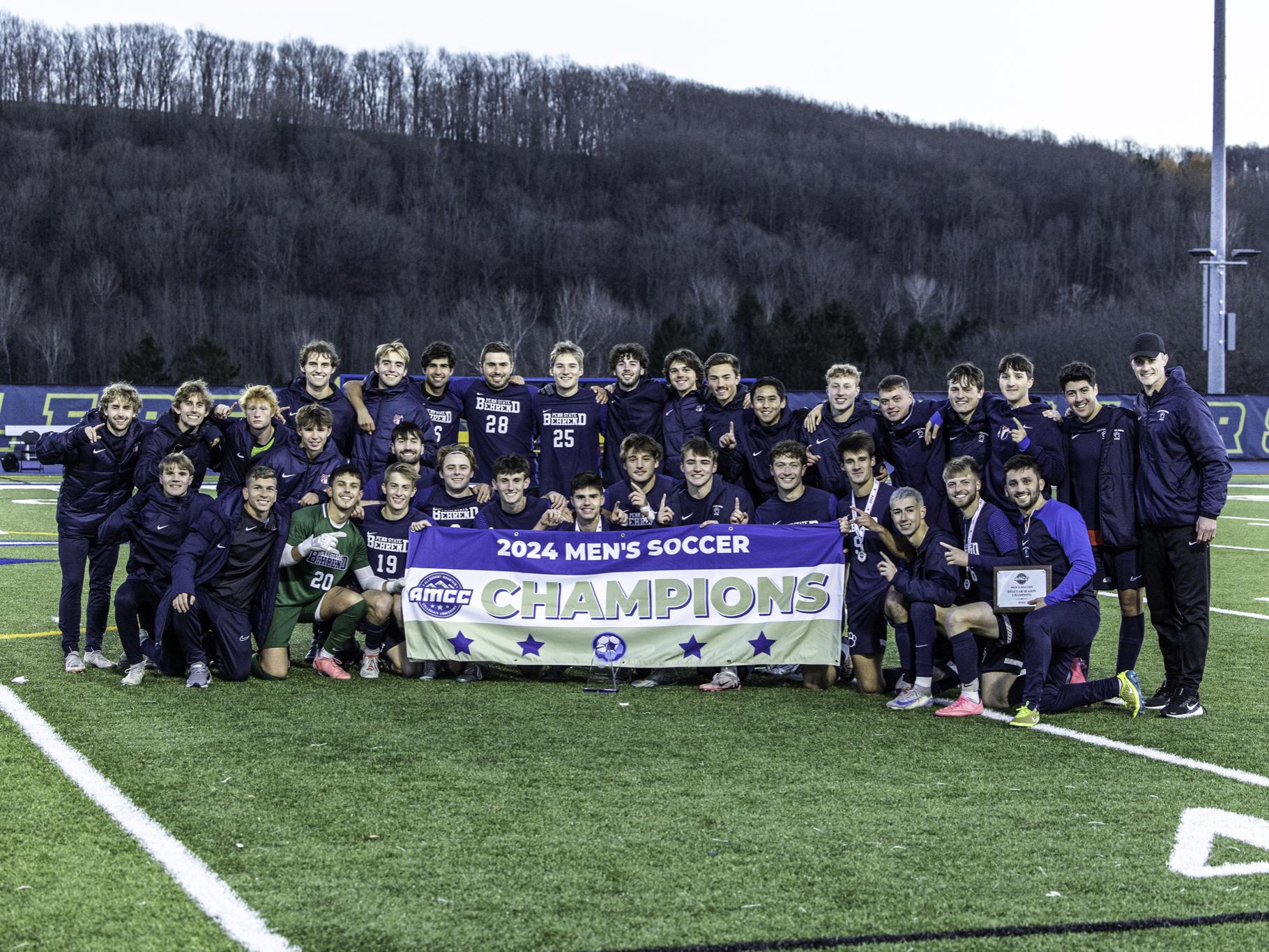 The Penn State Behrend men's soccer team poses with the AMCC championship banner.