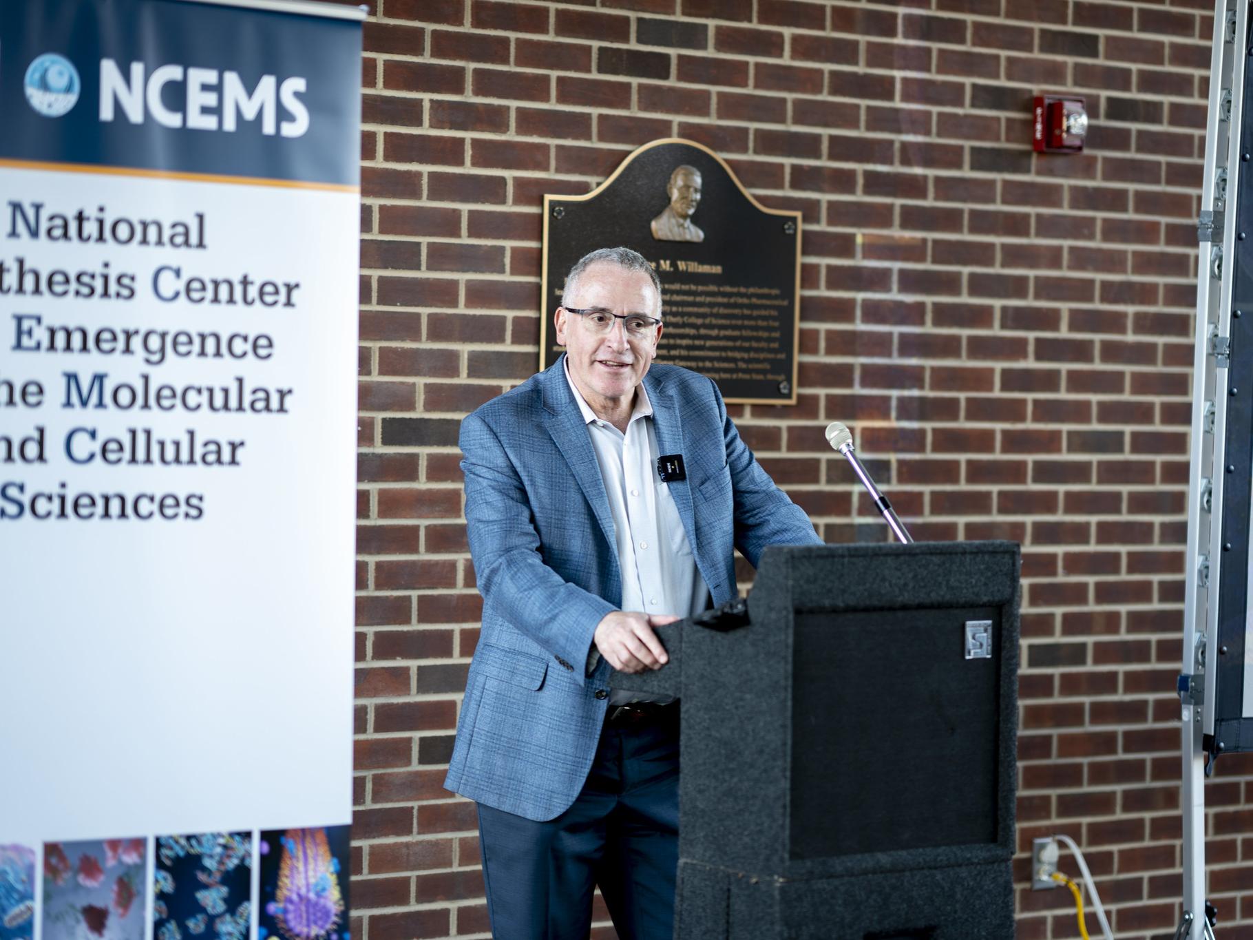 Person stands at podium