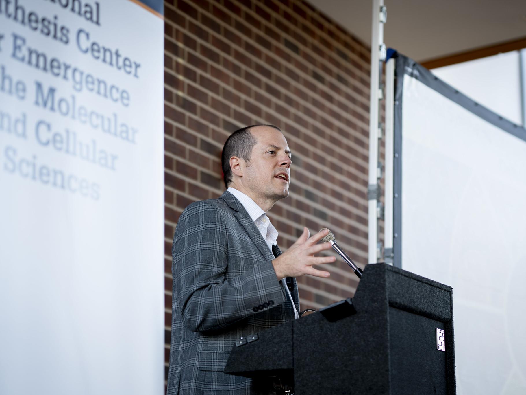 Person stands at a podium
