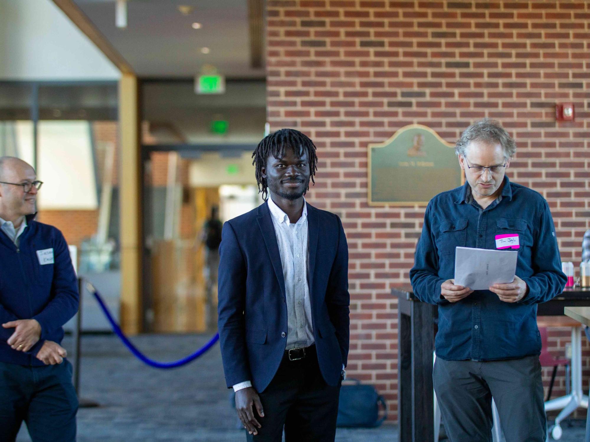 Edward Amoah accepts the first-place prize for graduate podium presentation.