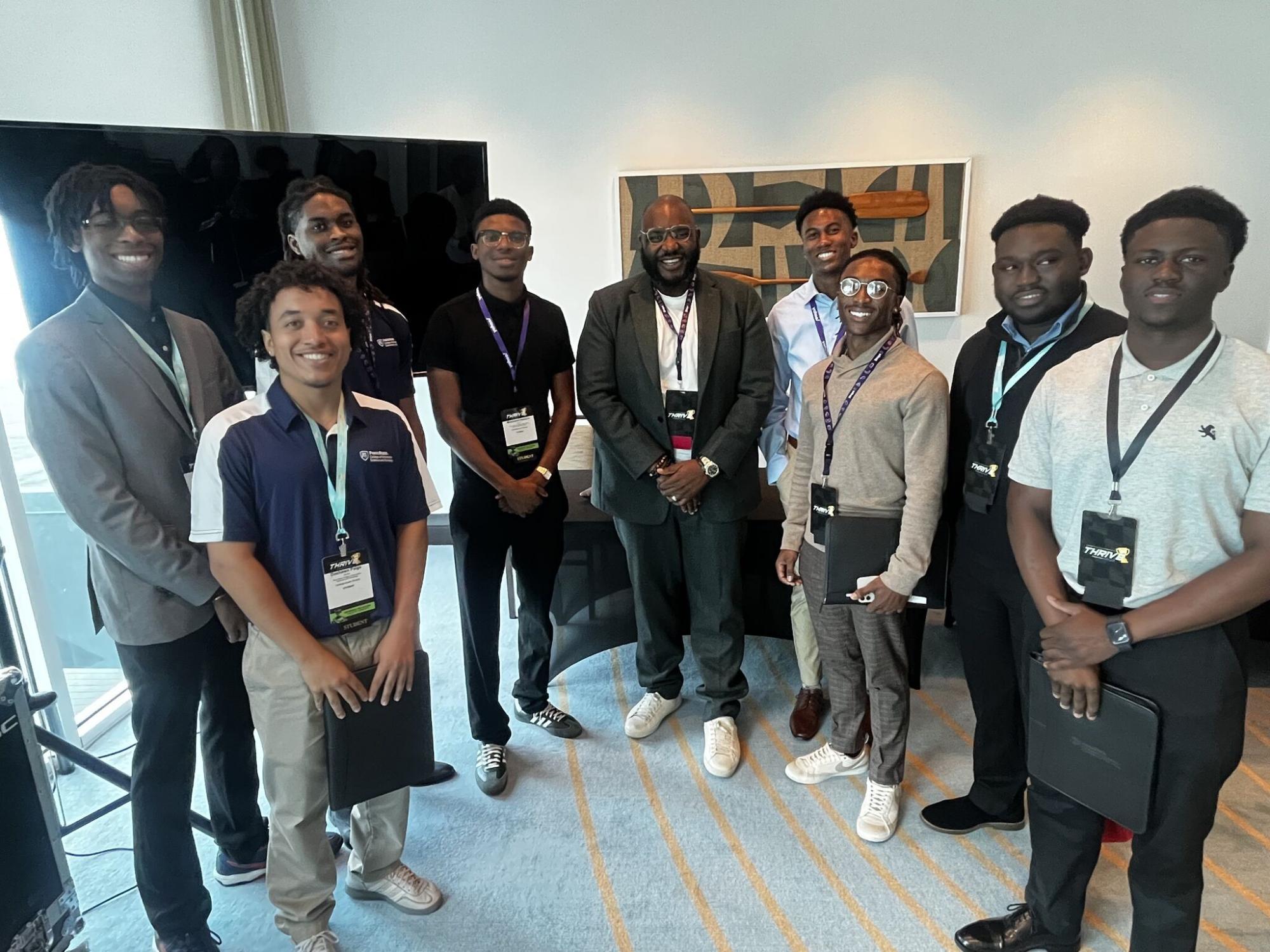 group of nine people at a conference