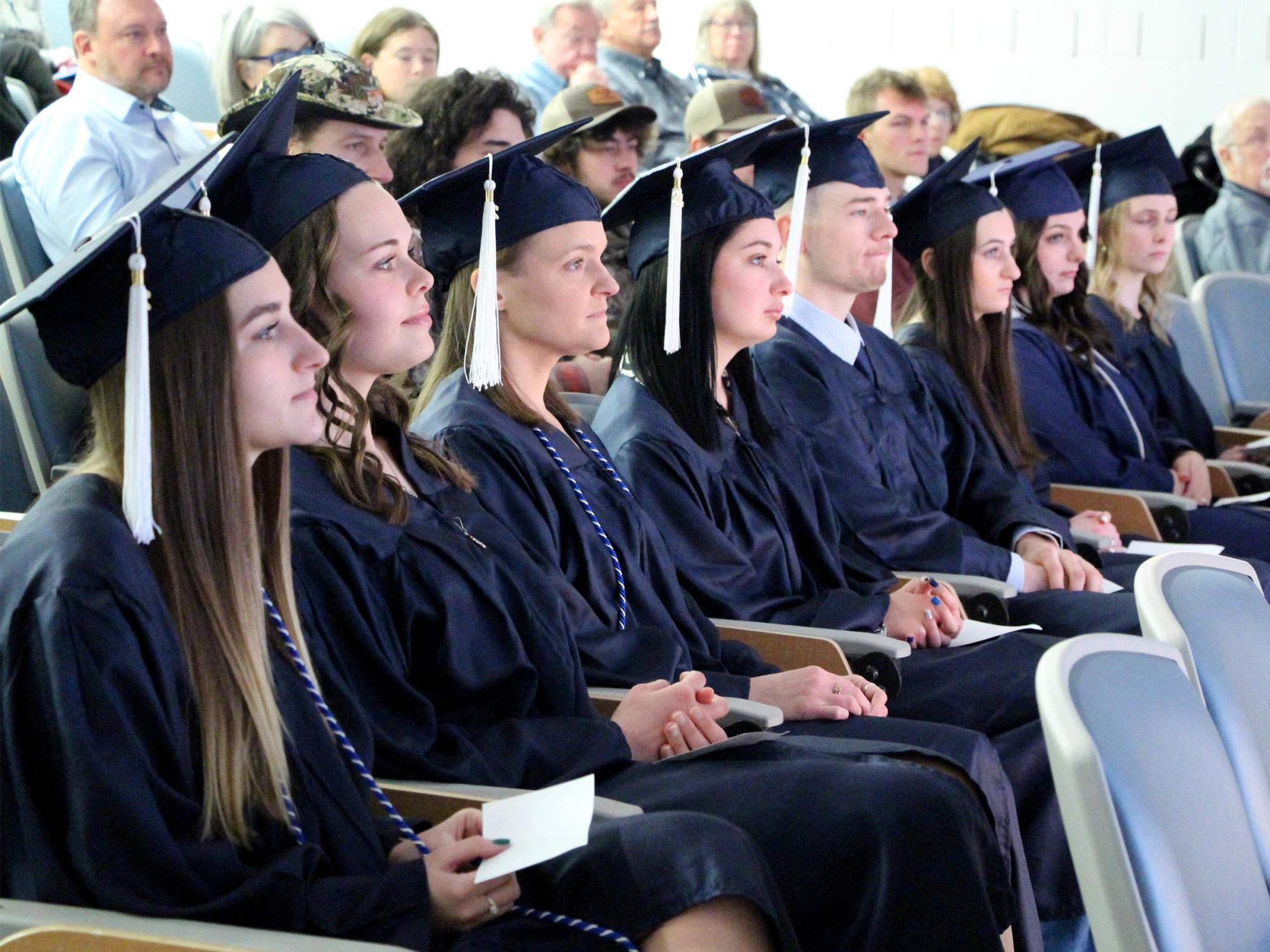 Graduates listen to the speakers during the commencement celebration for the class of fall 2024 at Penn State DuBois.