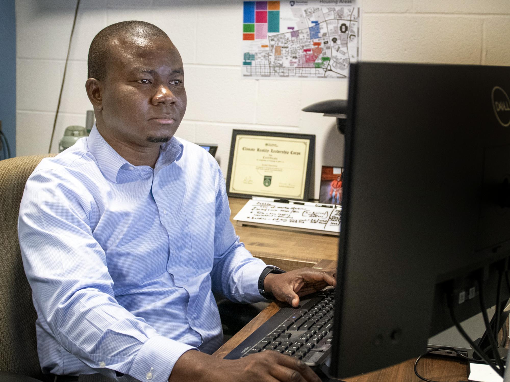 Ayo at his desk