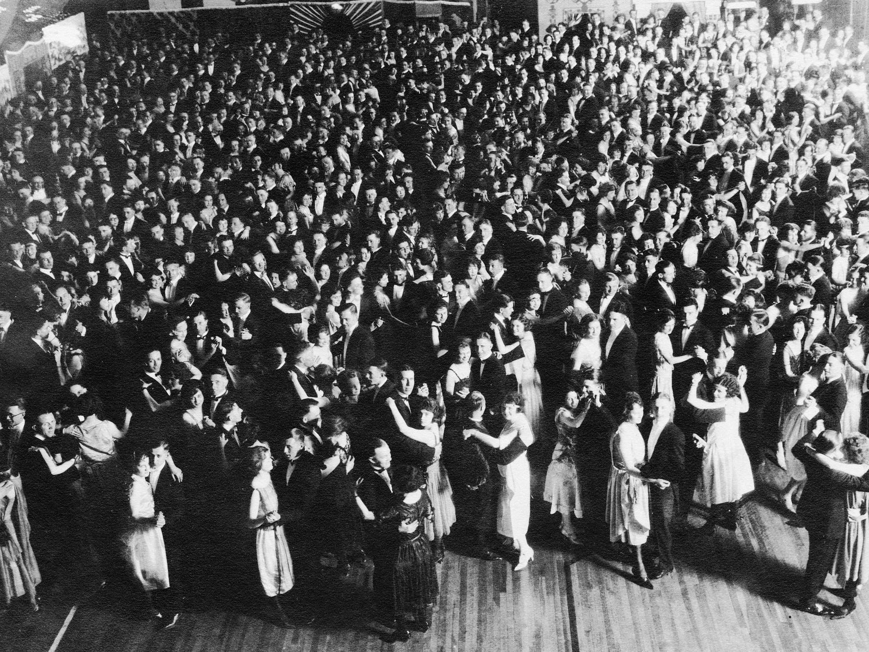 A black and white photo of couples dancing in the early 1920s