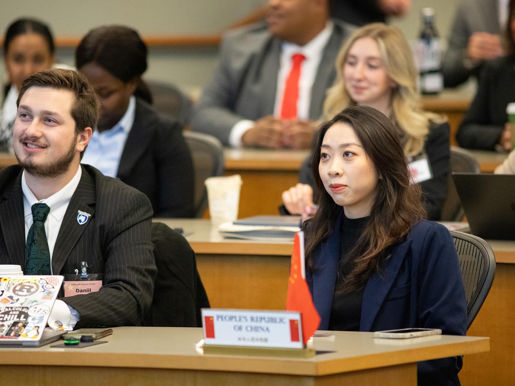SIA students Daniil Rose (left) and Yuting Zhang at the opening plenary session.