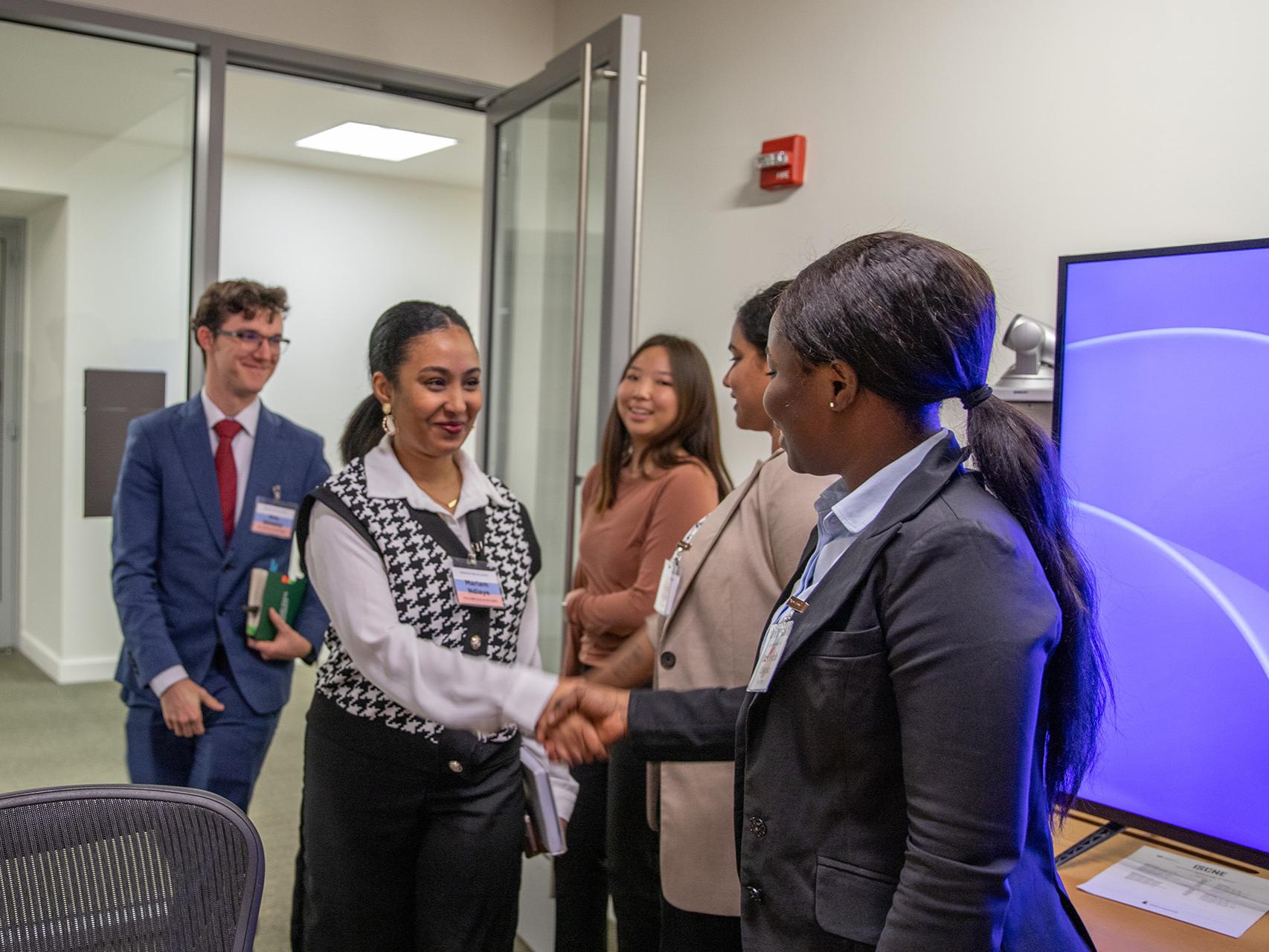 Mariam Ndiaye (left) conducts negotiations on behalf of team Russia.