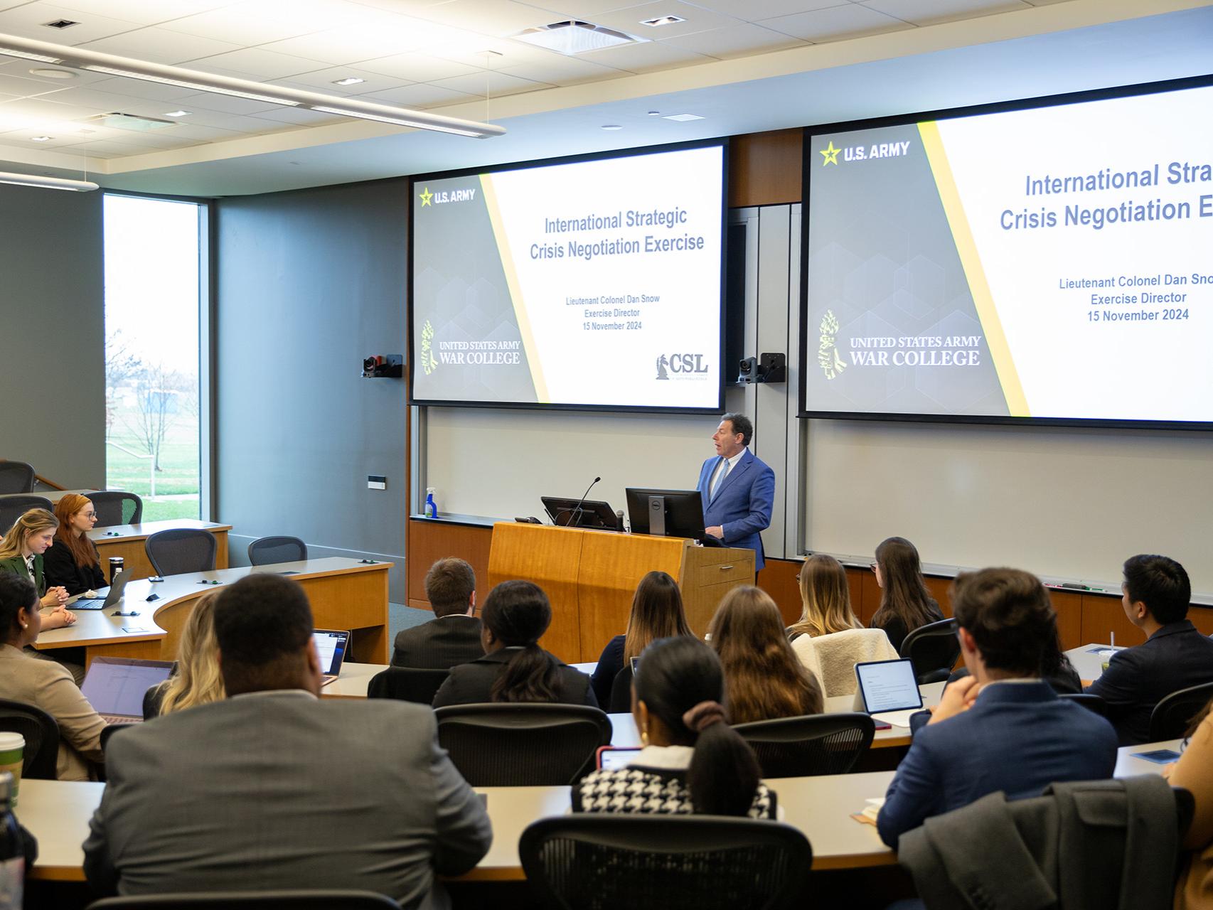 Dr. Mitchell Smith, director of SIA and professor of international affairs, addresses the students during the opening plenary session.