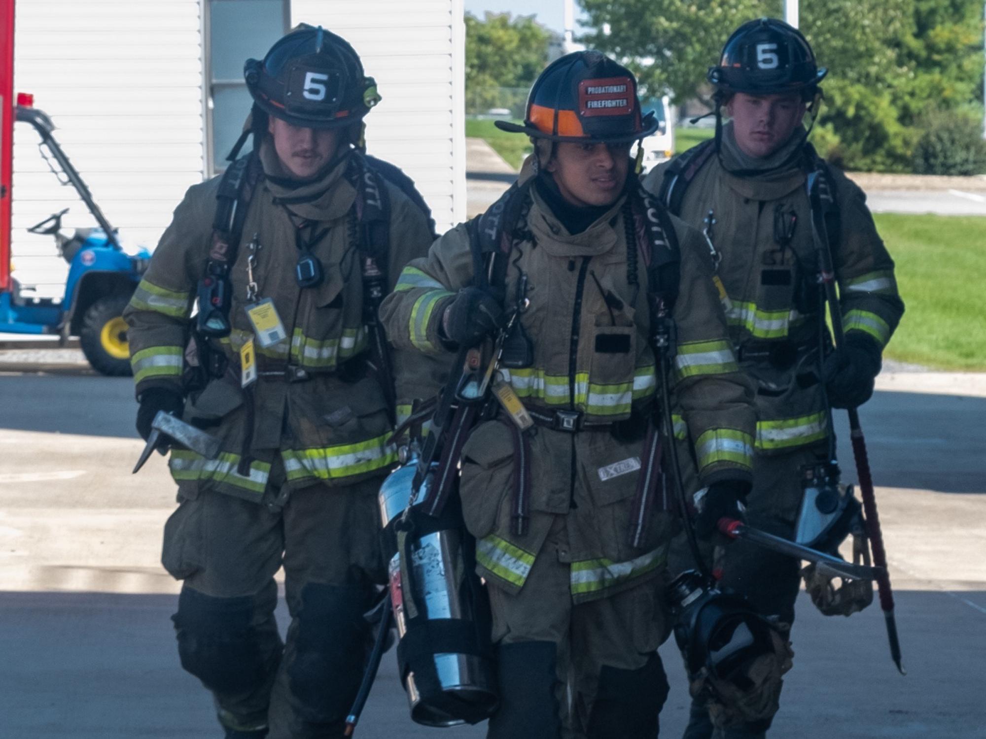 three firefighters in all their gear