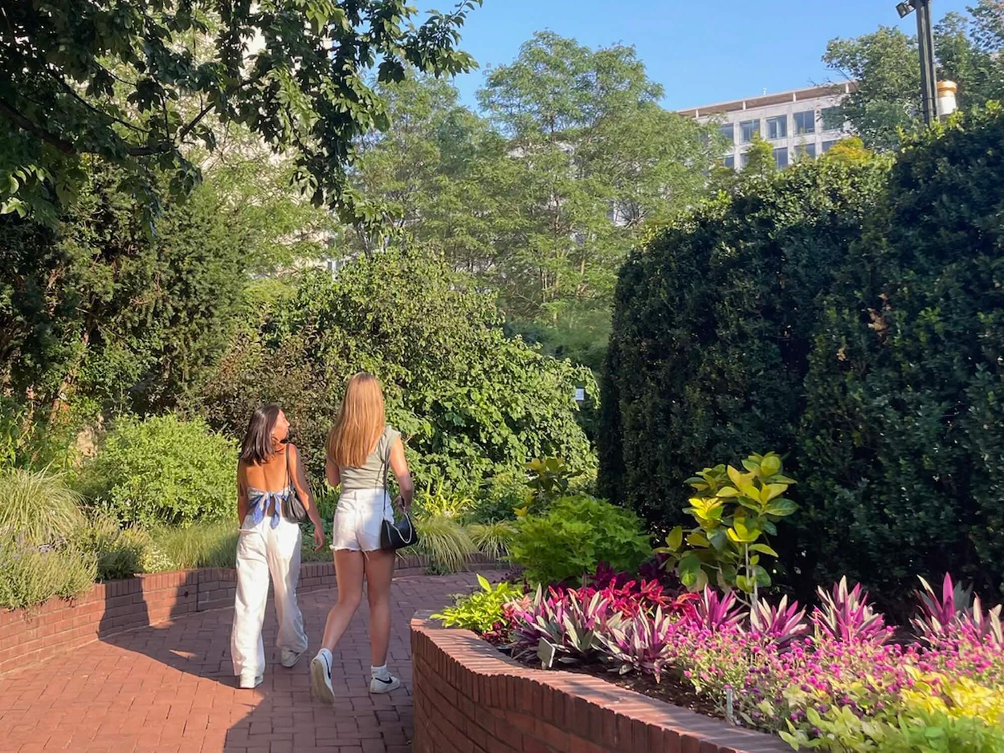 Charis Liu (left) and a friend walk through gardens in Washington, D.C.