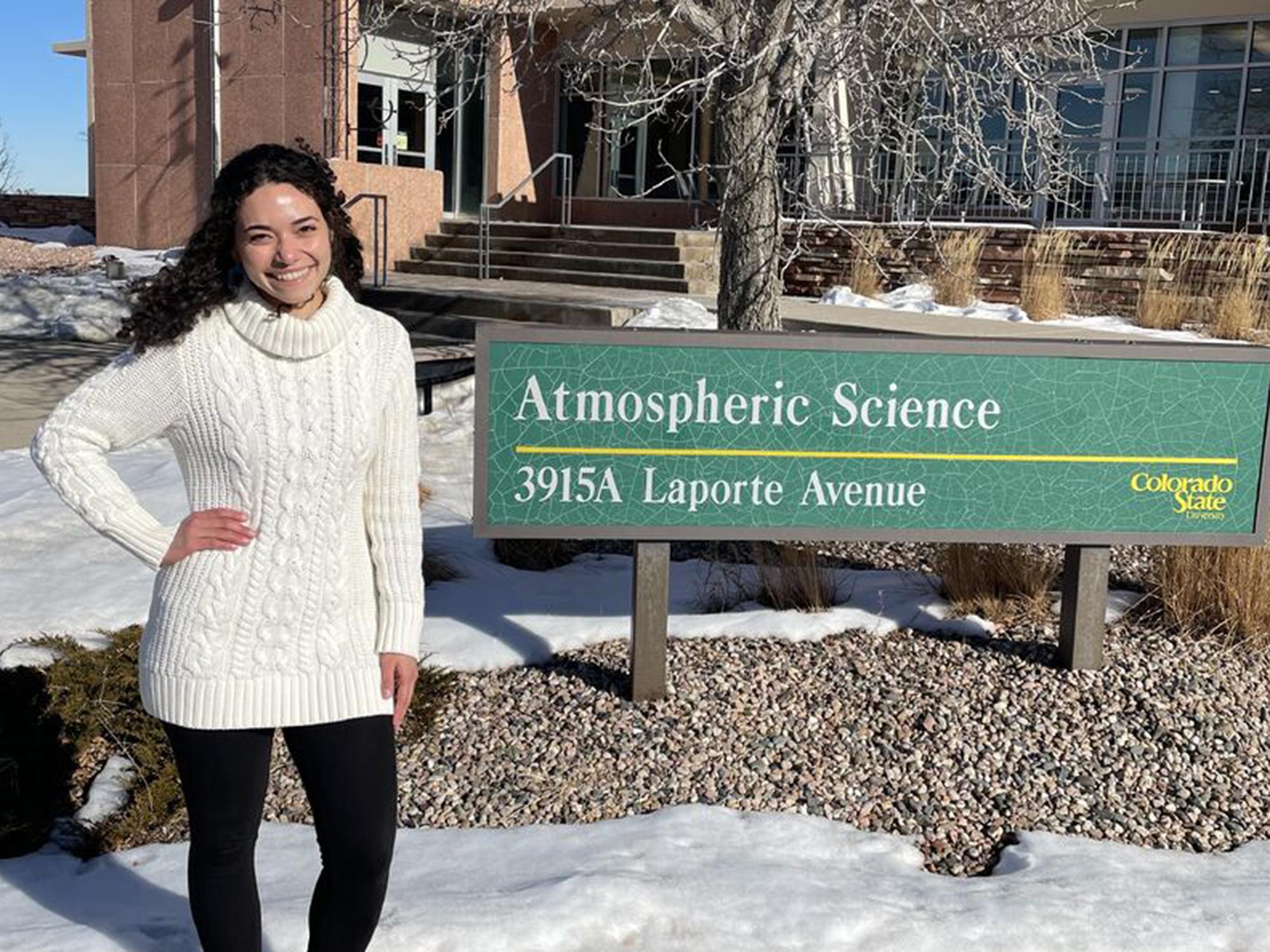 Millennium Scholar graduate Delián Colón Burgos stands at Colorado State University sign.