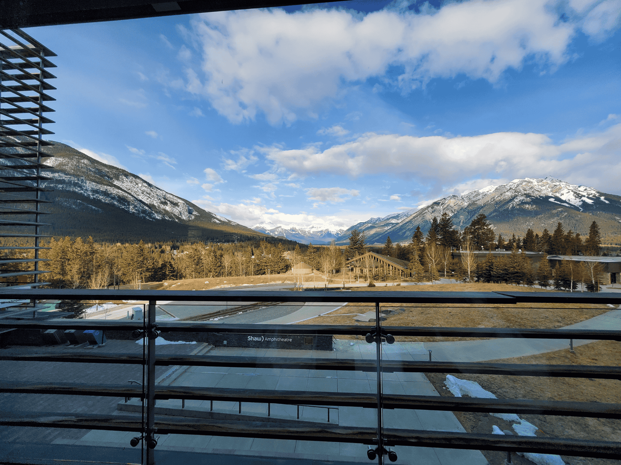 A mountainscape with a parking lot in the foreground in Banff, Canada