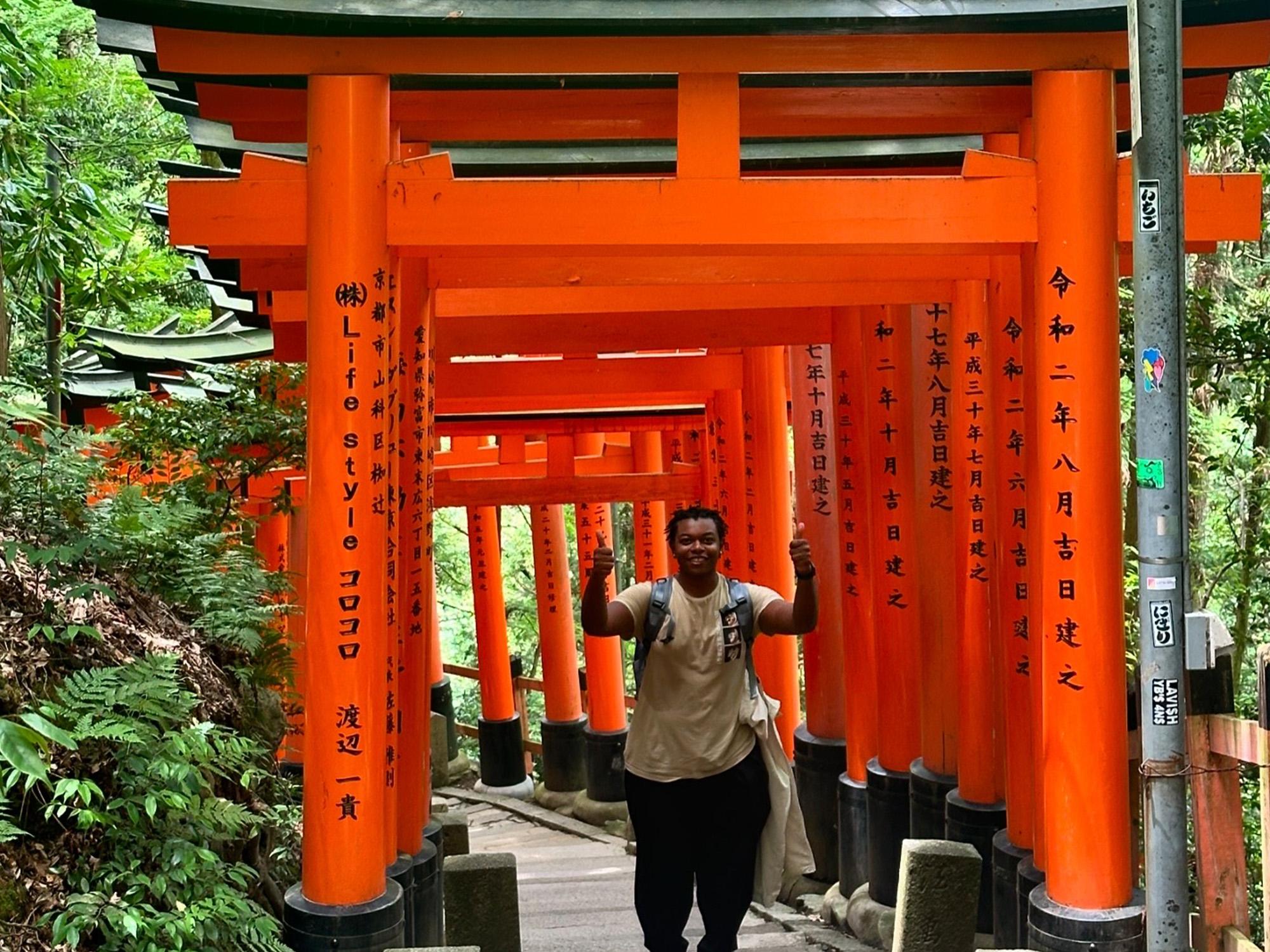 : Zion Sykes visits Fushimi Inari Shrine while studying abroad in Japan.
