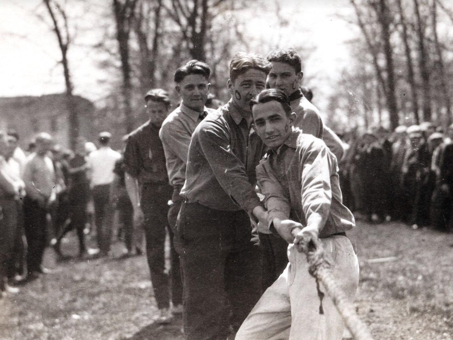 Students pull on a rope in a tug of war competition in 1924