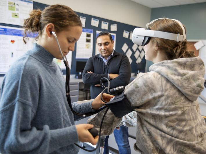 Diana Stoltzfus, left, takes baseline measurements of her study participant.