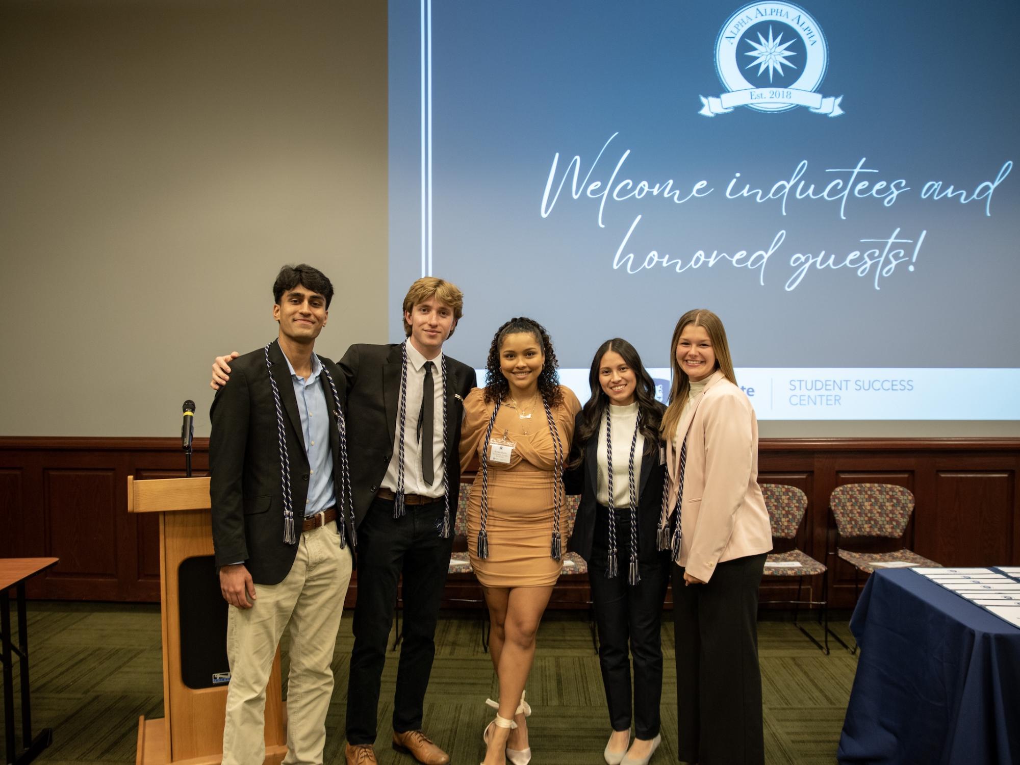 The executive board of the Eta Psi chapter of Tri-Alpha pose for a photo