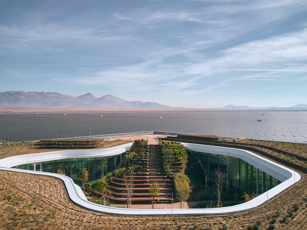 A power plant control building located in a desert. 
