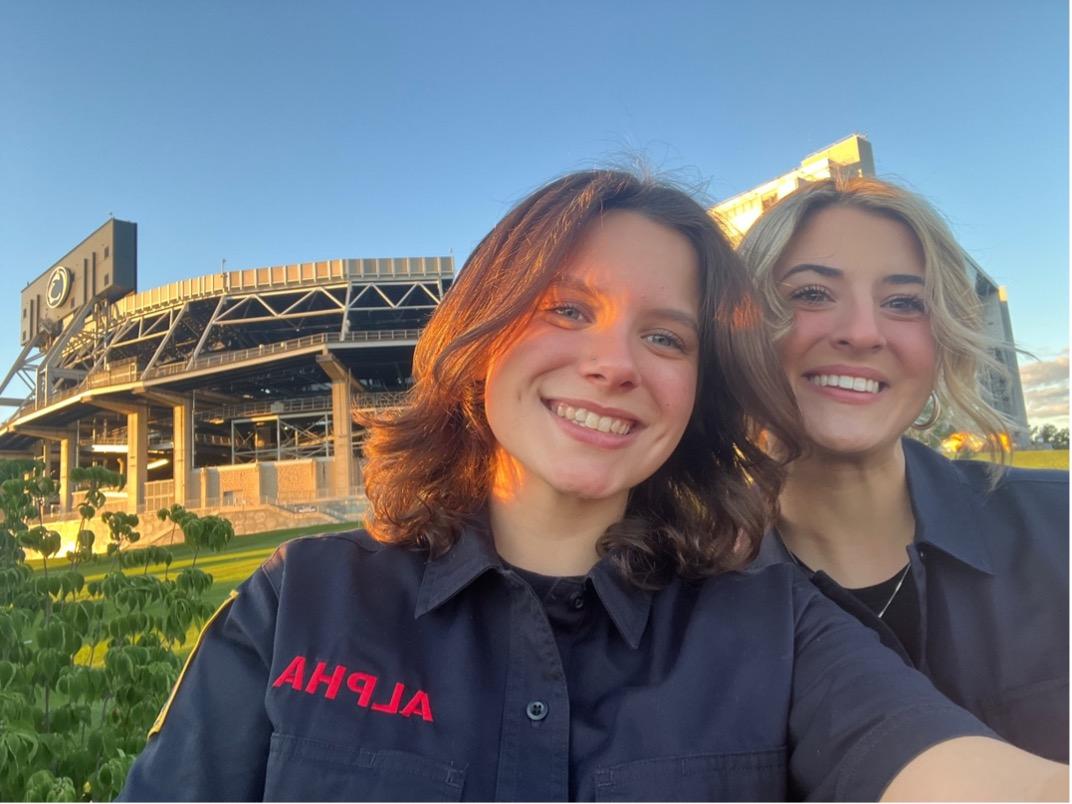 Kara Stover (left) poses outside Beaver Stadium with a friend.