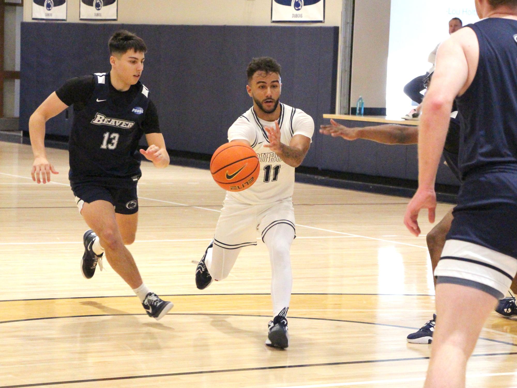 Penn State DuBois sophomore guard Kaleb Pryor drives toward the lane and passes the ball to a teammate during a recent basketball game at the PAW Center.