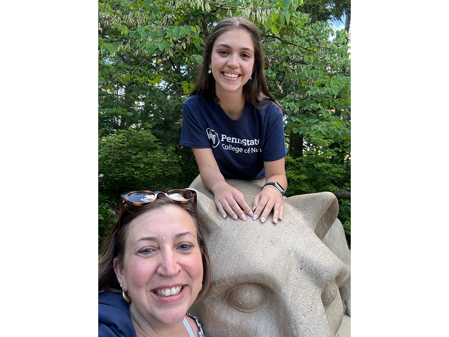 Leah (top) and mother, Wendy, at the University Park Lion Shrine