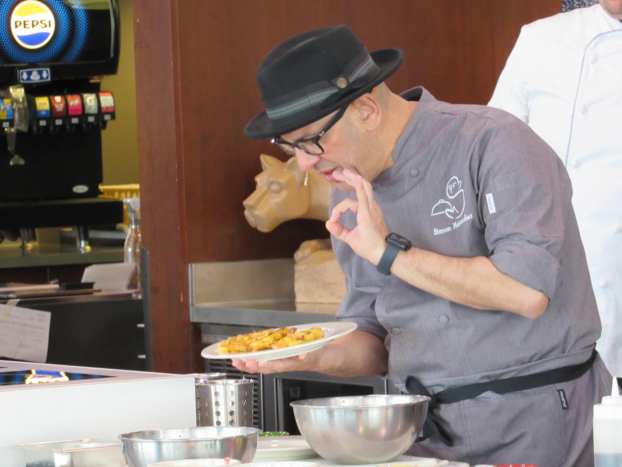 Simon Majumdar during a cooking demo from his 2024 visit to Penn State