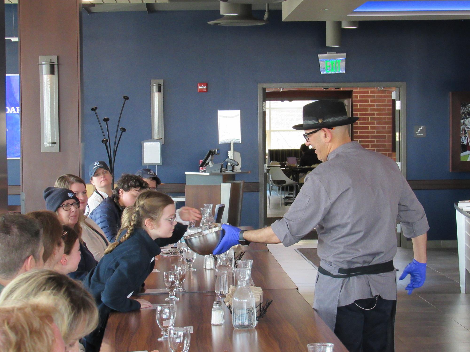 Simon Majumdar during a cooking demo from his 2024 visit to Penn State