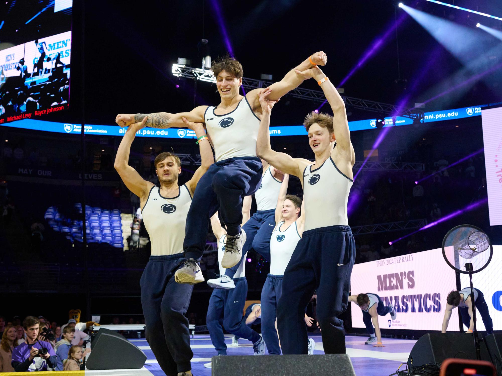 Penn State men's gymnastics team competing during pep rally