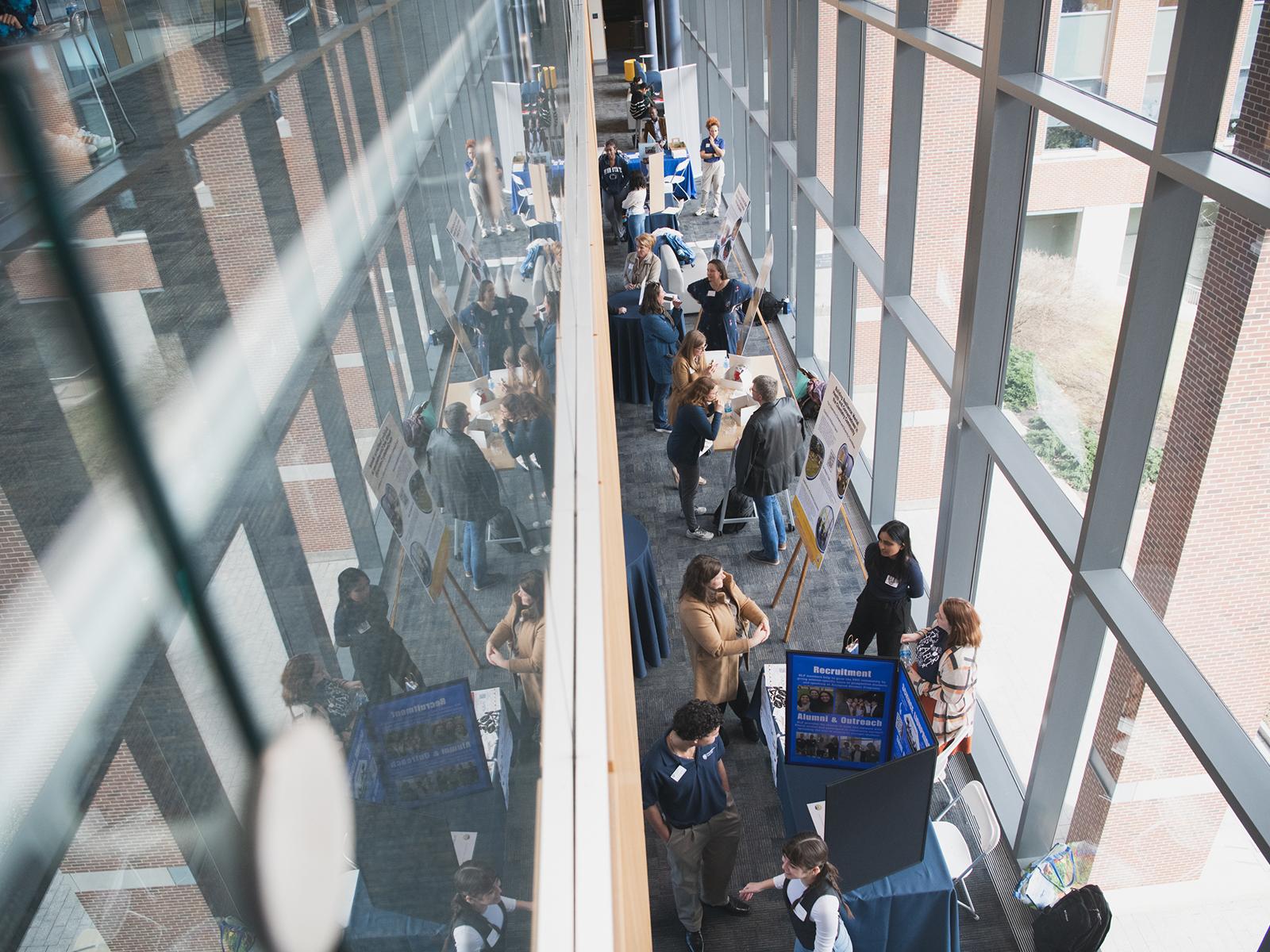 Attendees participated in a poster session at the Eberly College's inaugural Science Equity & Diversity Conference, March 19, 2025.