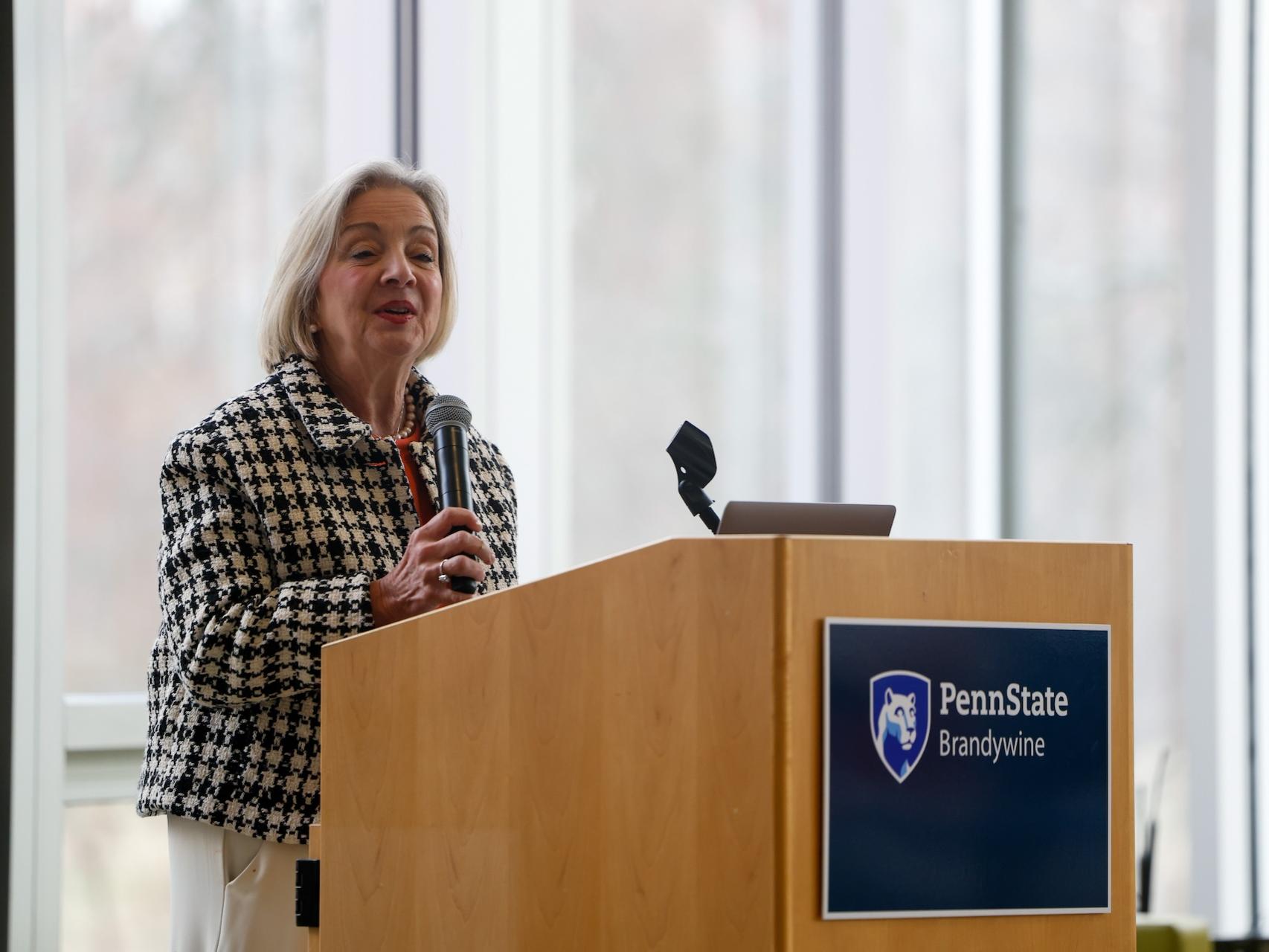 woman speaking at podium