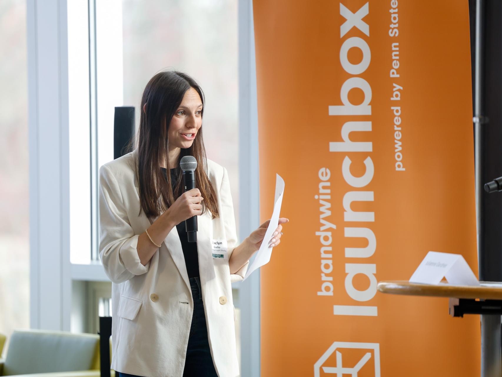 woman speaking into microphone
