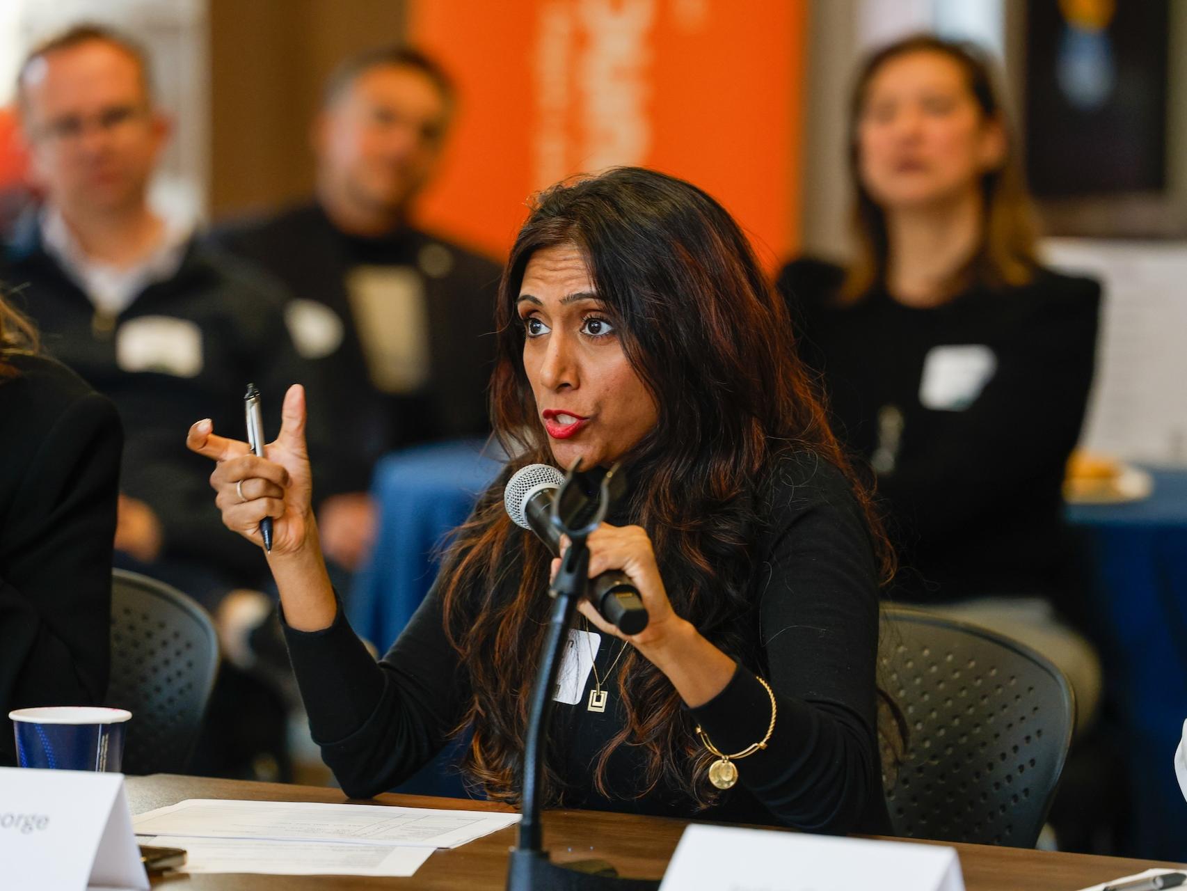 woman speaking into microphone