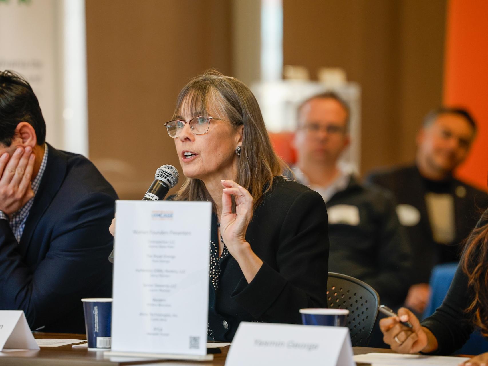 woman speaking into microphone