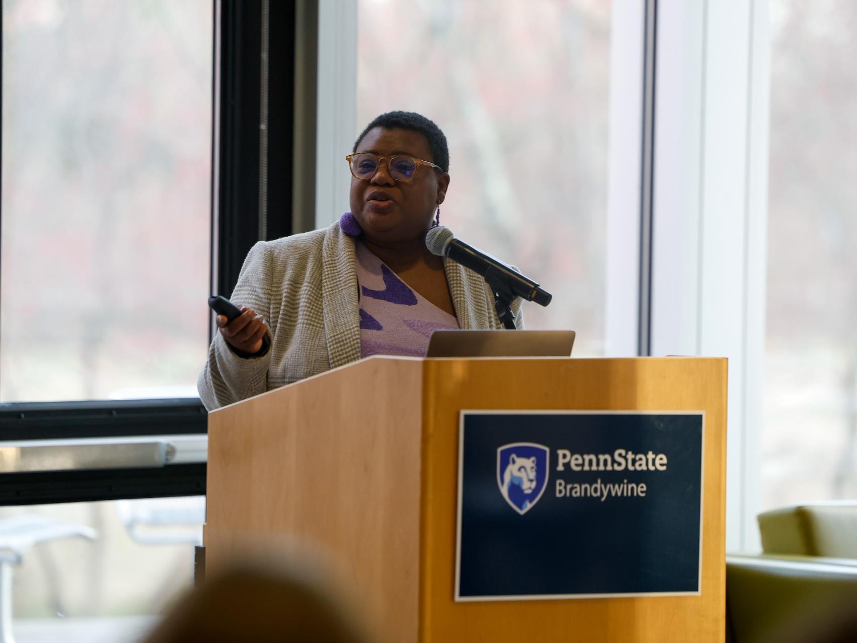 woman speaking at podium