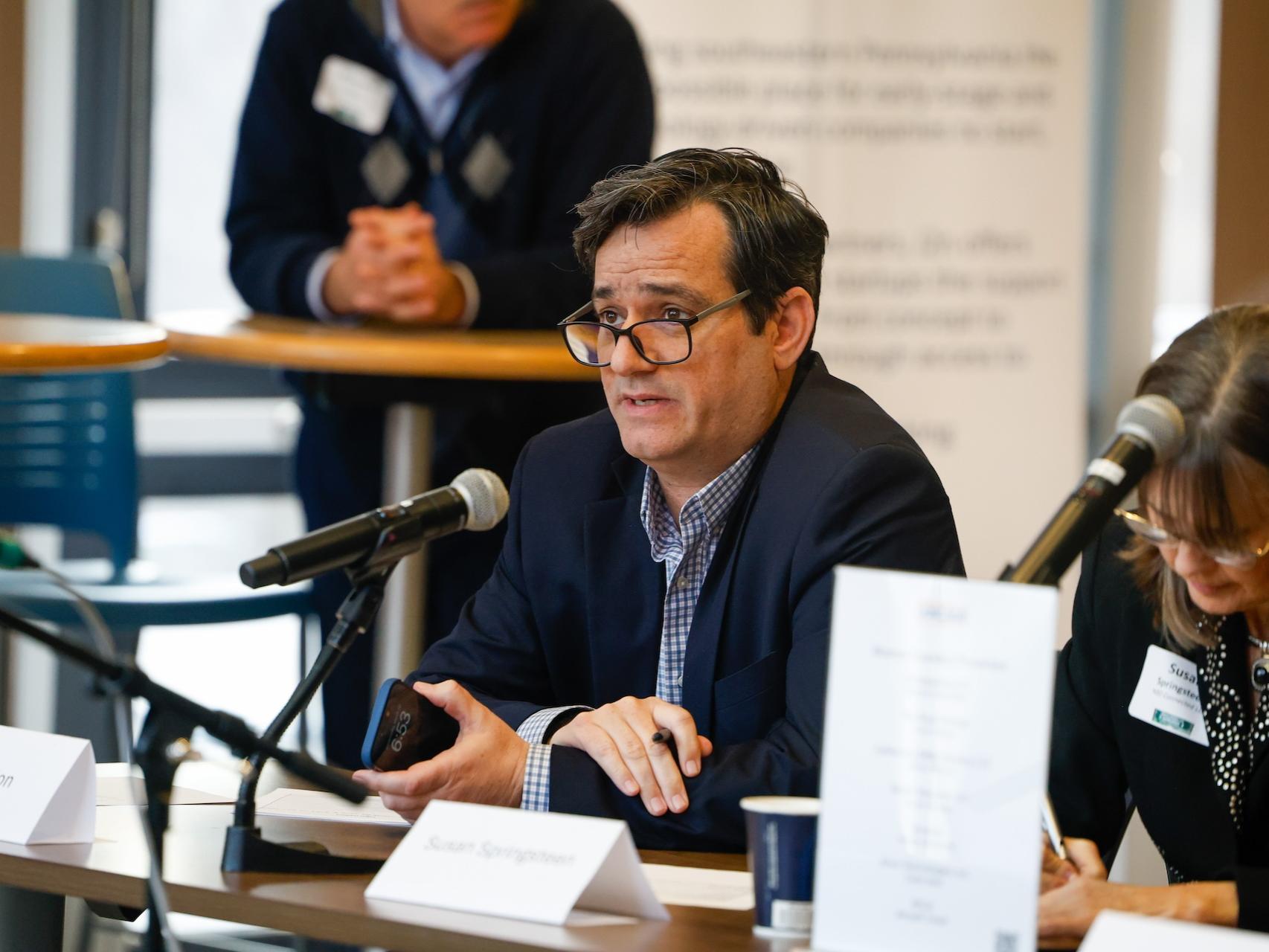 man speaking into microphone