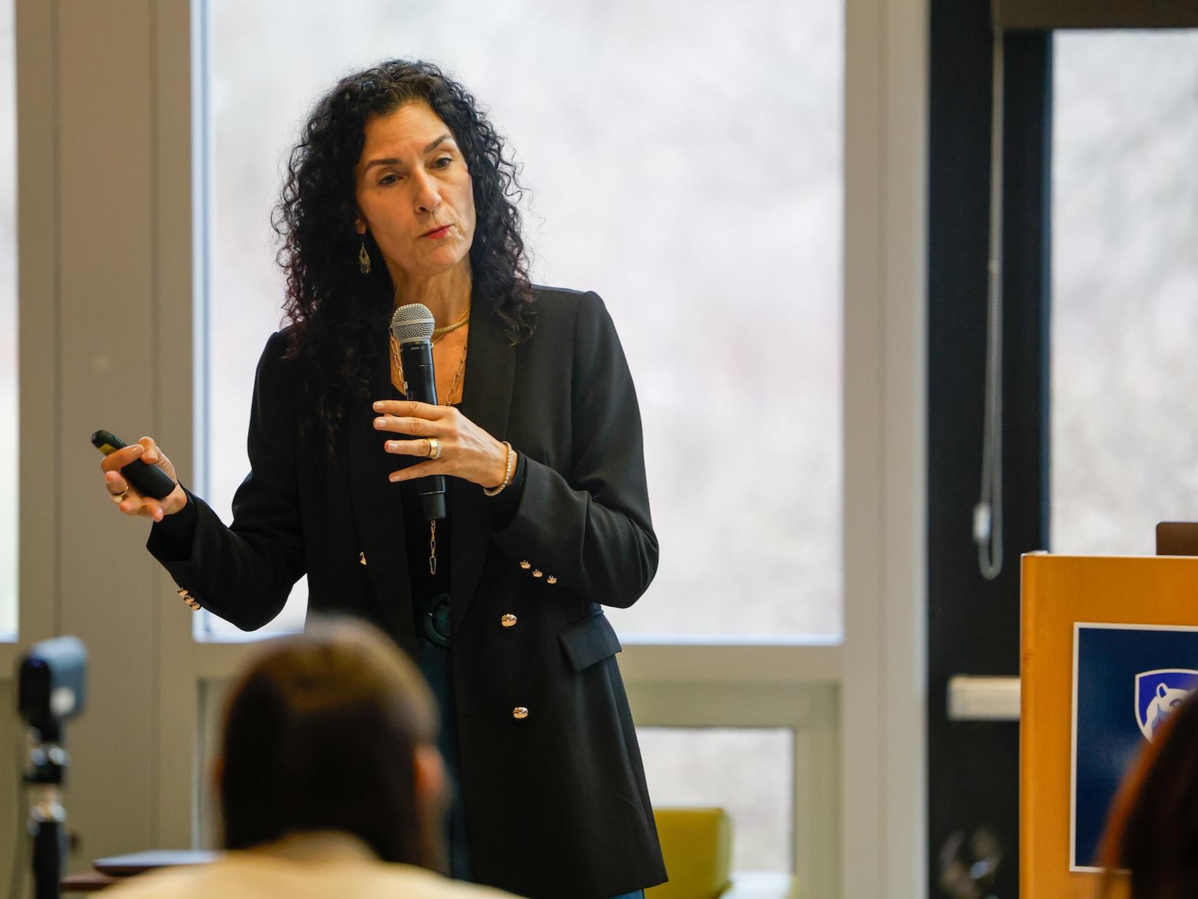 woman speaking into microphone