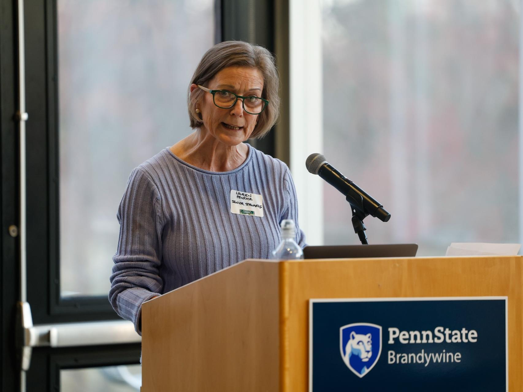 woman speaking at podium