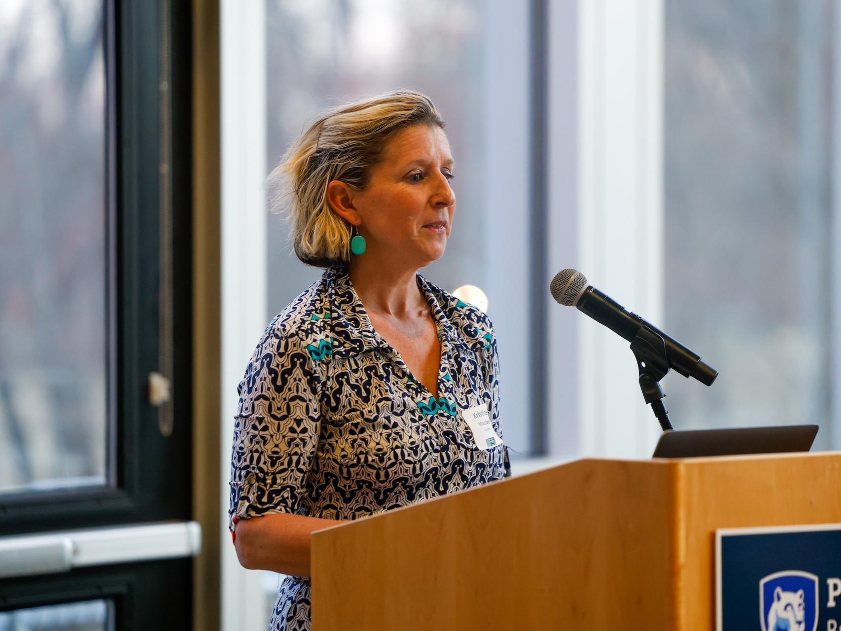woman speaking at podium