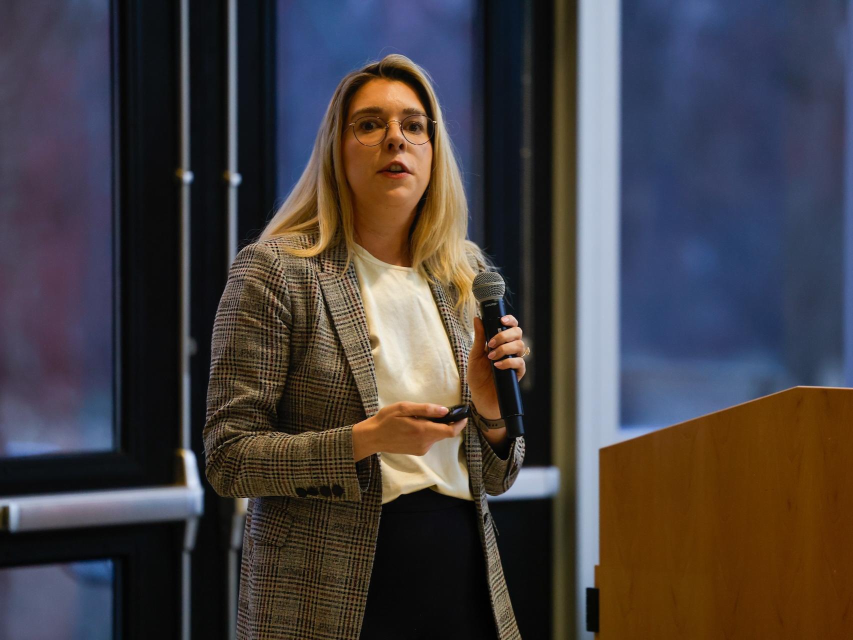 woman speaking into microphone