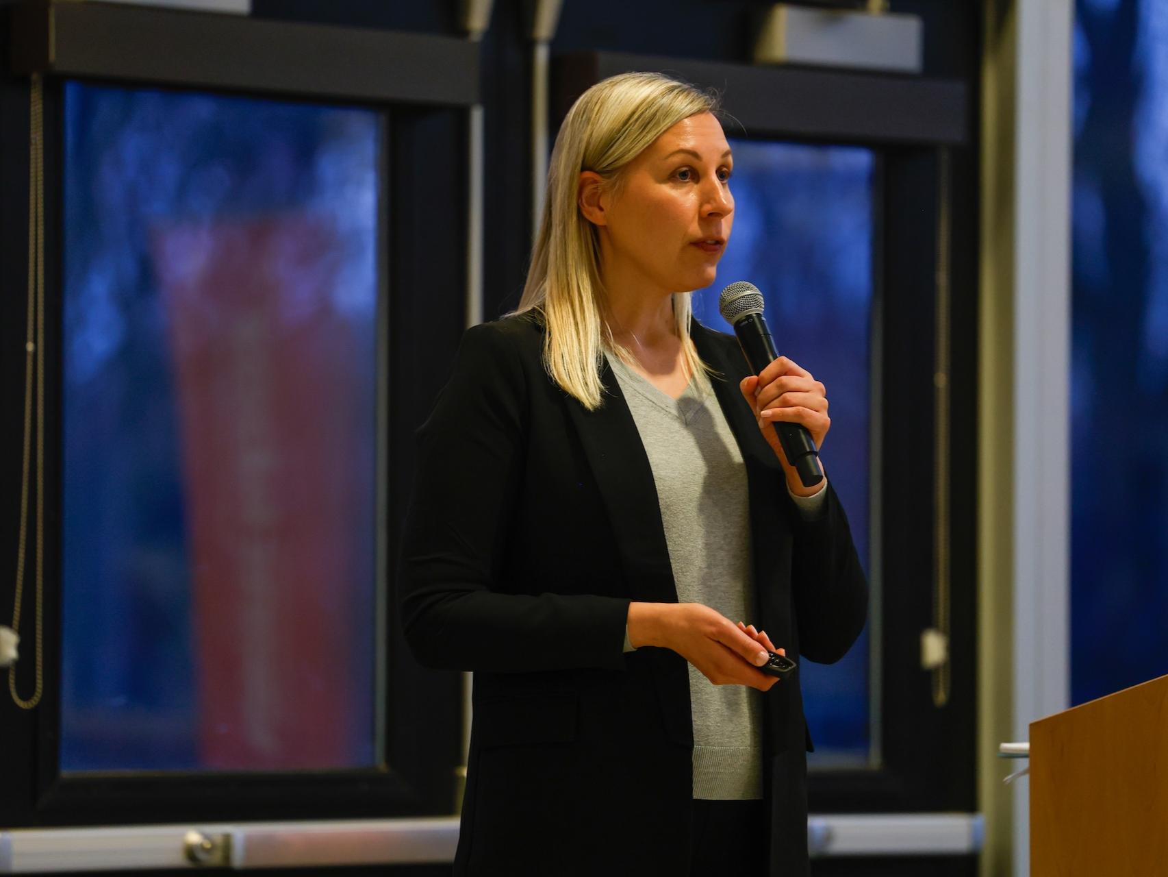 woman speaking into microphone