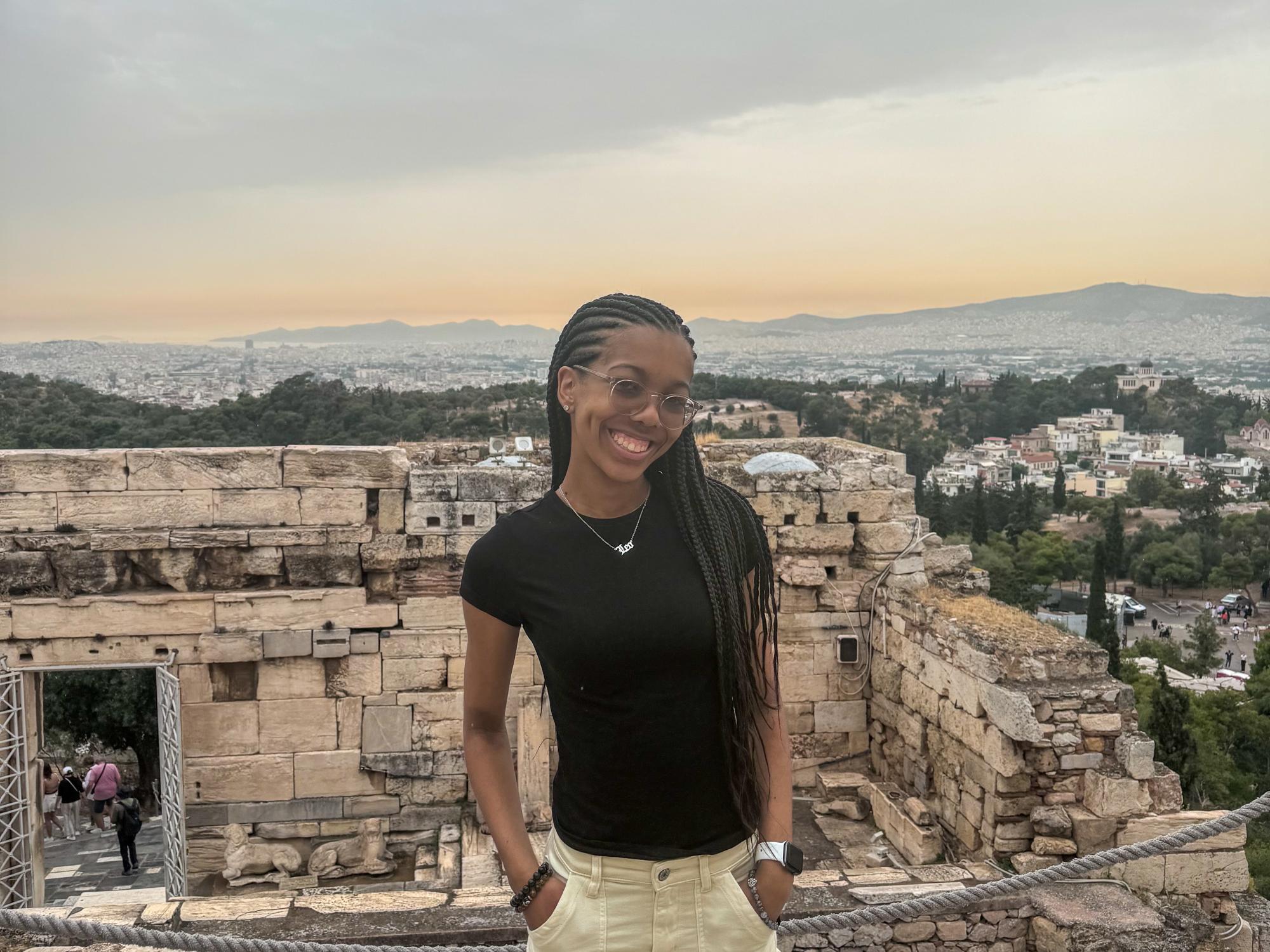 Laci Campbell stands in front of ruins in Athens, Greece.