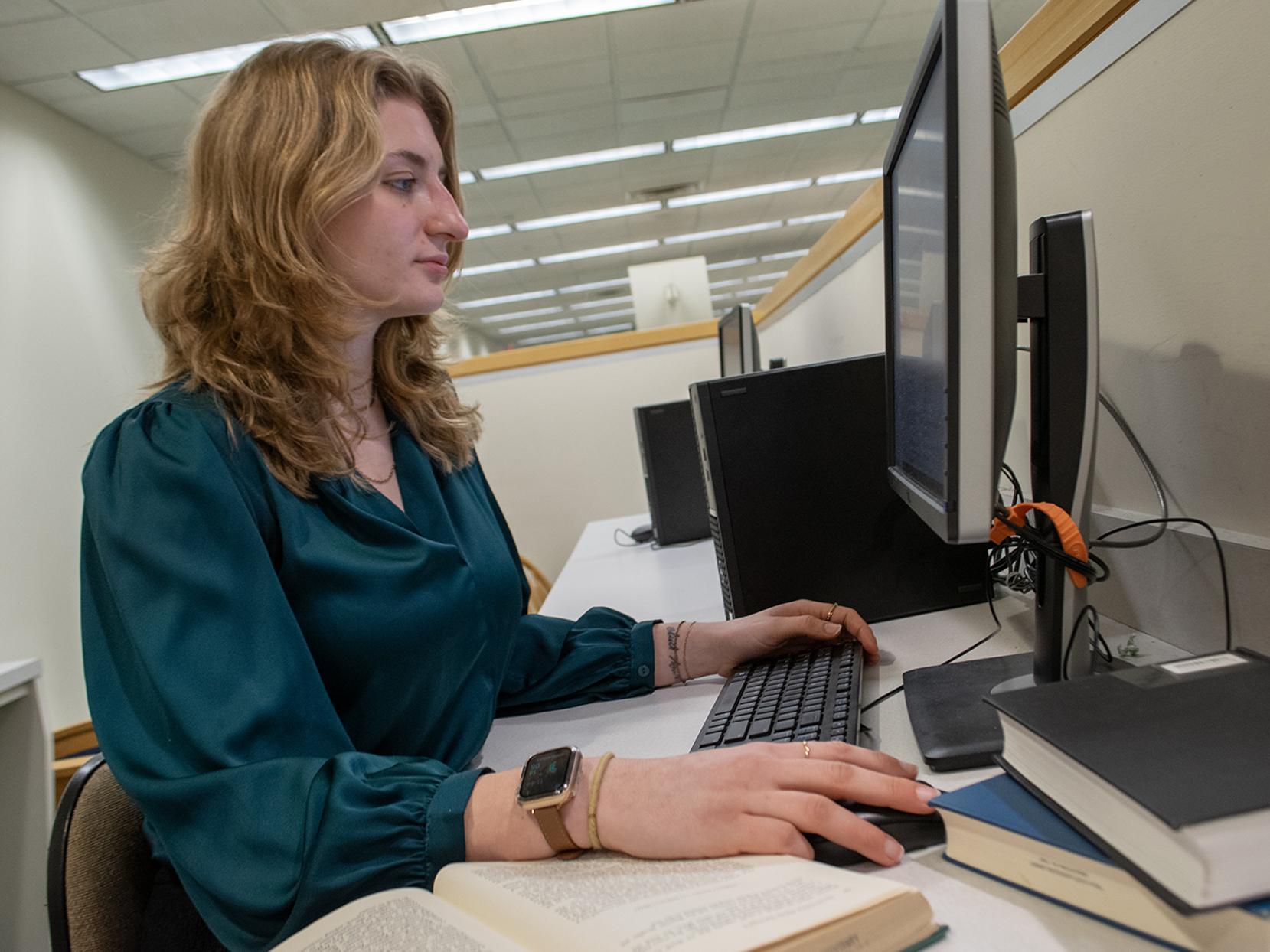 Charli Nowak works at a computer