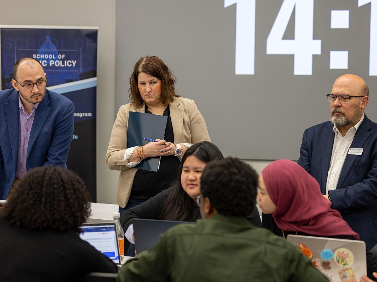 Policy simulation competition judges (left to right) Mike Tylka, Amy Farkas, and Lilliard Richardson