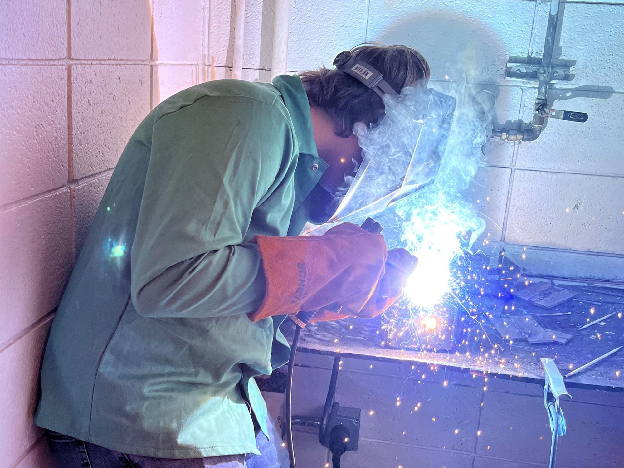 Dutch Manufacturing student Isaac Perlick works on his cube project using the shielded metal arc welding process.