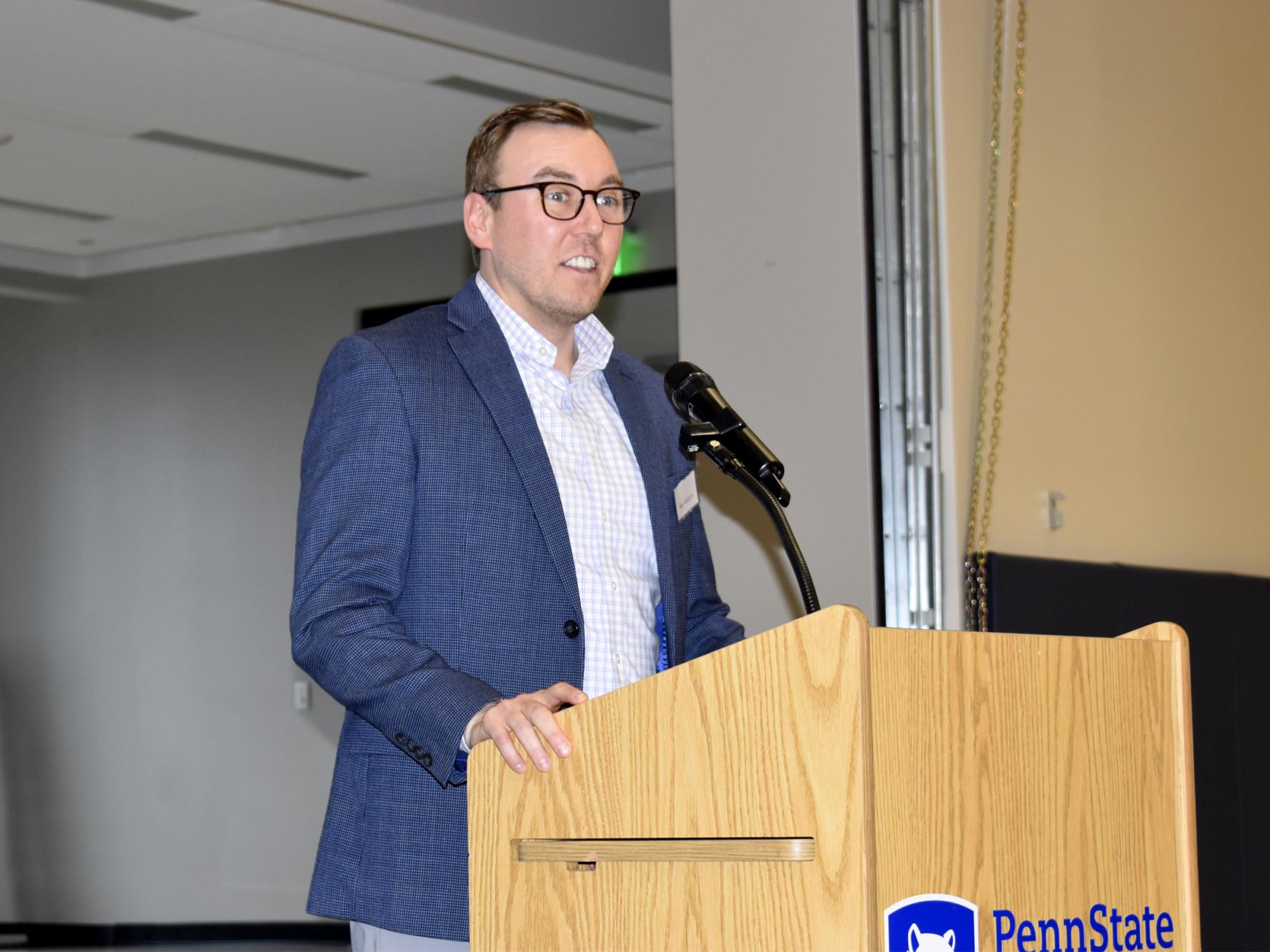 Alex Gasbarre speaks during the scholarship luncheon at the PAW Center.