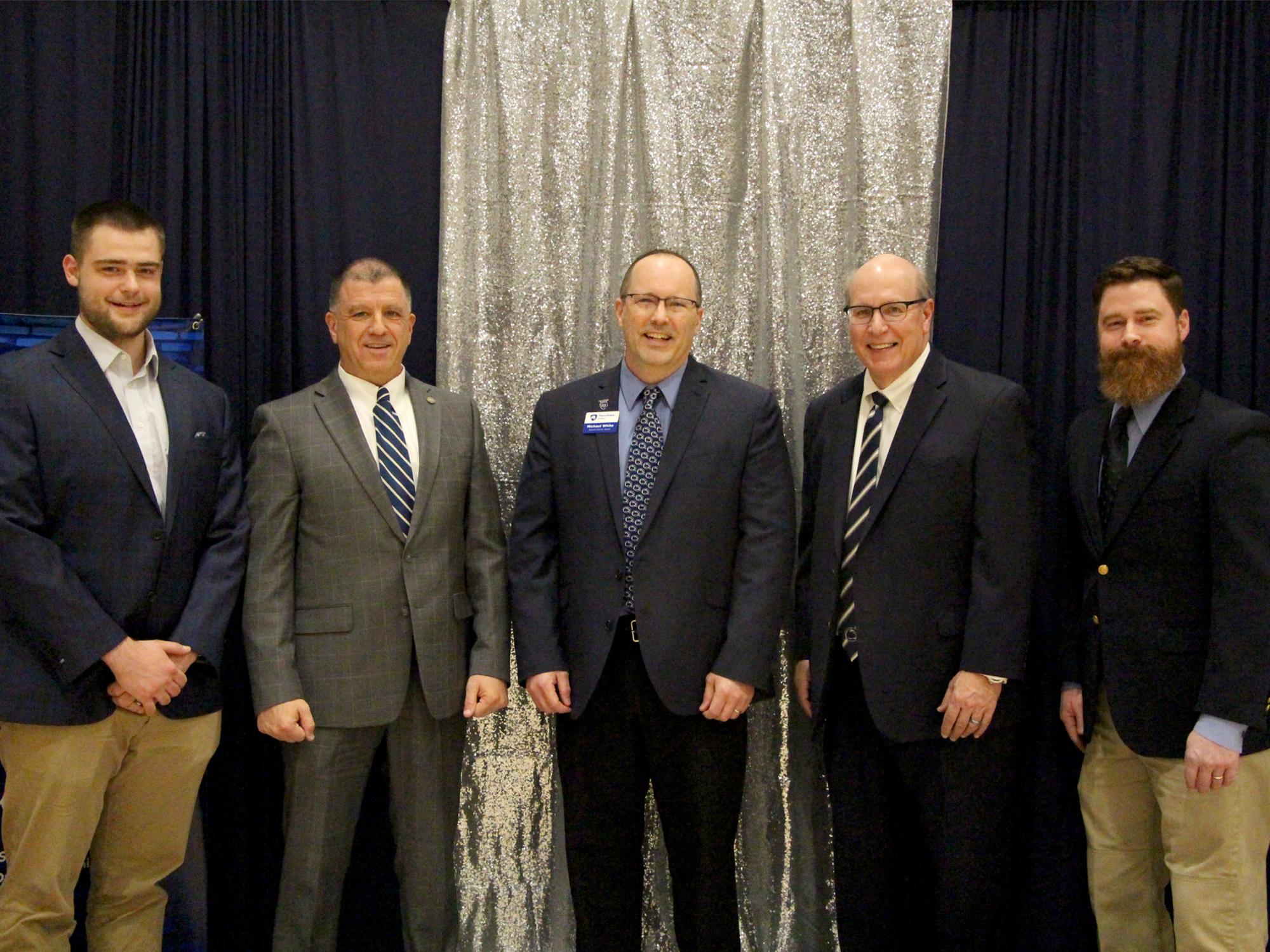 Individuals honored by the Penn State DuBois Alumni Society during the Lions, Legacy and Laughter event during We Are Weekend. From left to right, Dylan Treaster, Michael Peduzzi, Michael White, president of the Penn State DuBois Alumni Society, Stephen Massini and Thomas Keller.