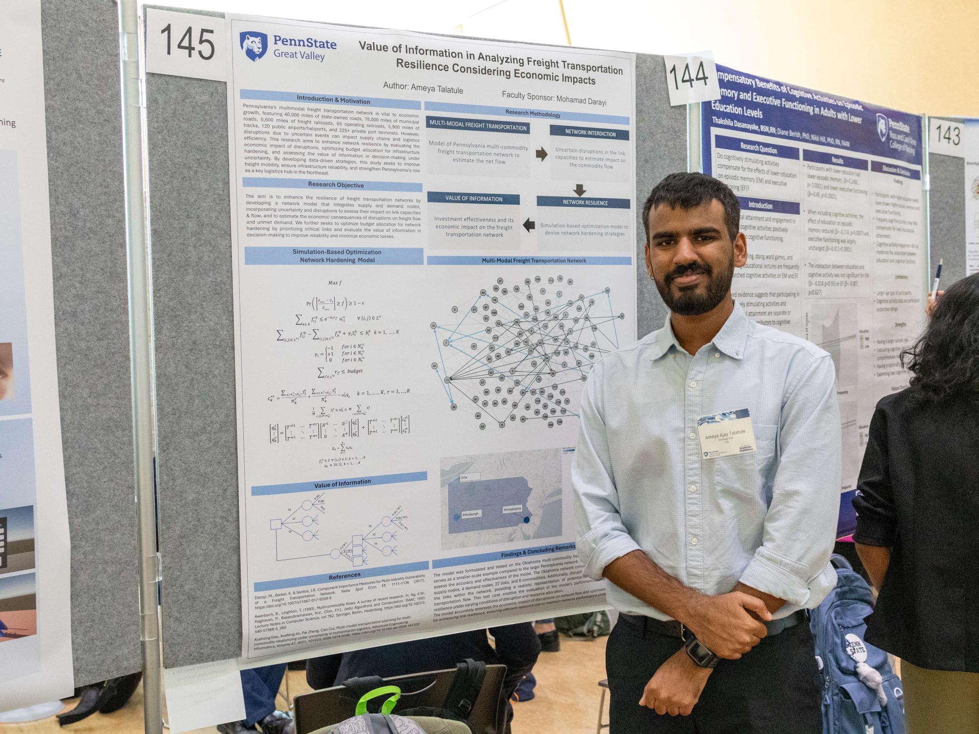 Student researcher Ameya Talatule stands in front of his research poster on freight transportation resilience