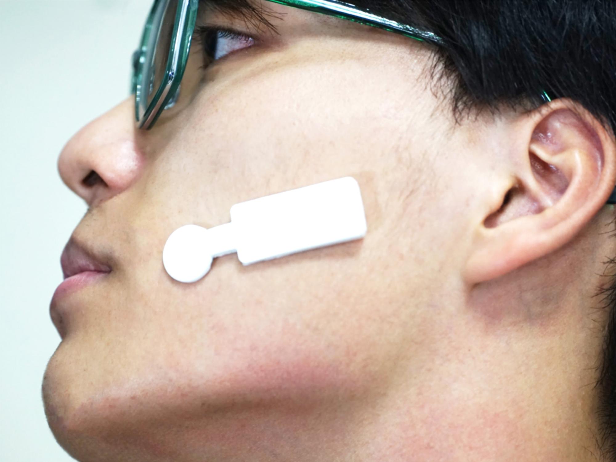 A sensor that tracks signals of emotion is places on a person's face