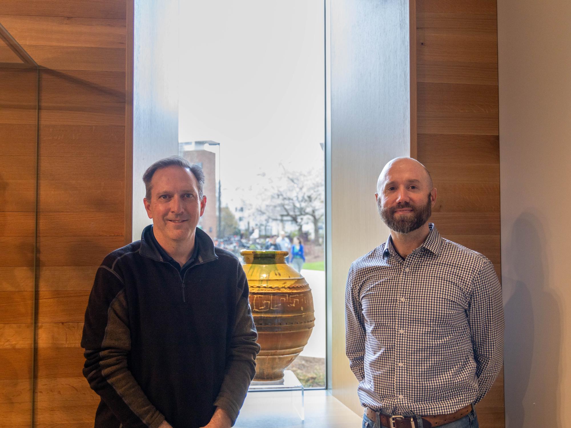 Tom Flynn and James Doyle stand near Matson Museum display. 