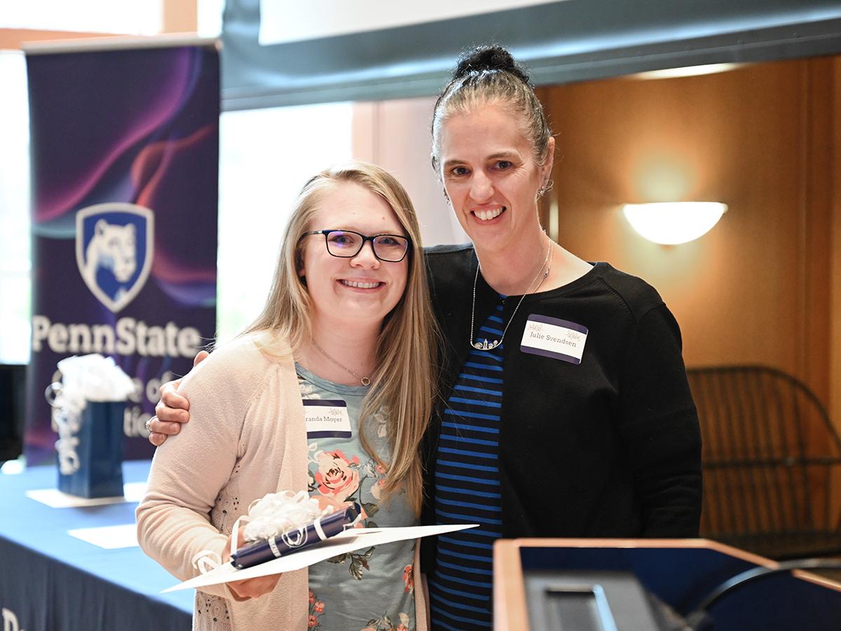 Miranda Moyer receives an award from presenter Julie Svendsen.