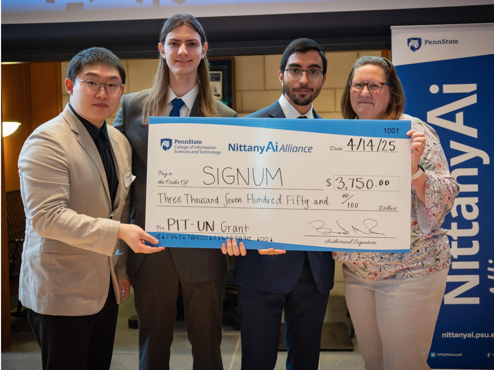 college students display giant check